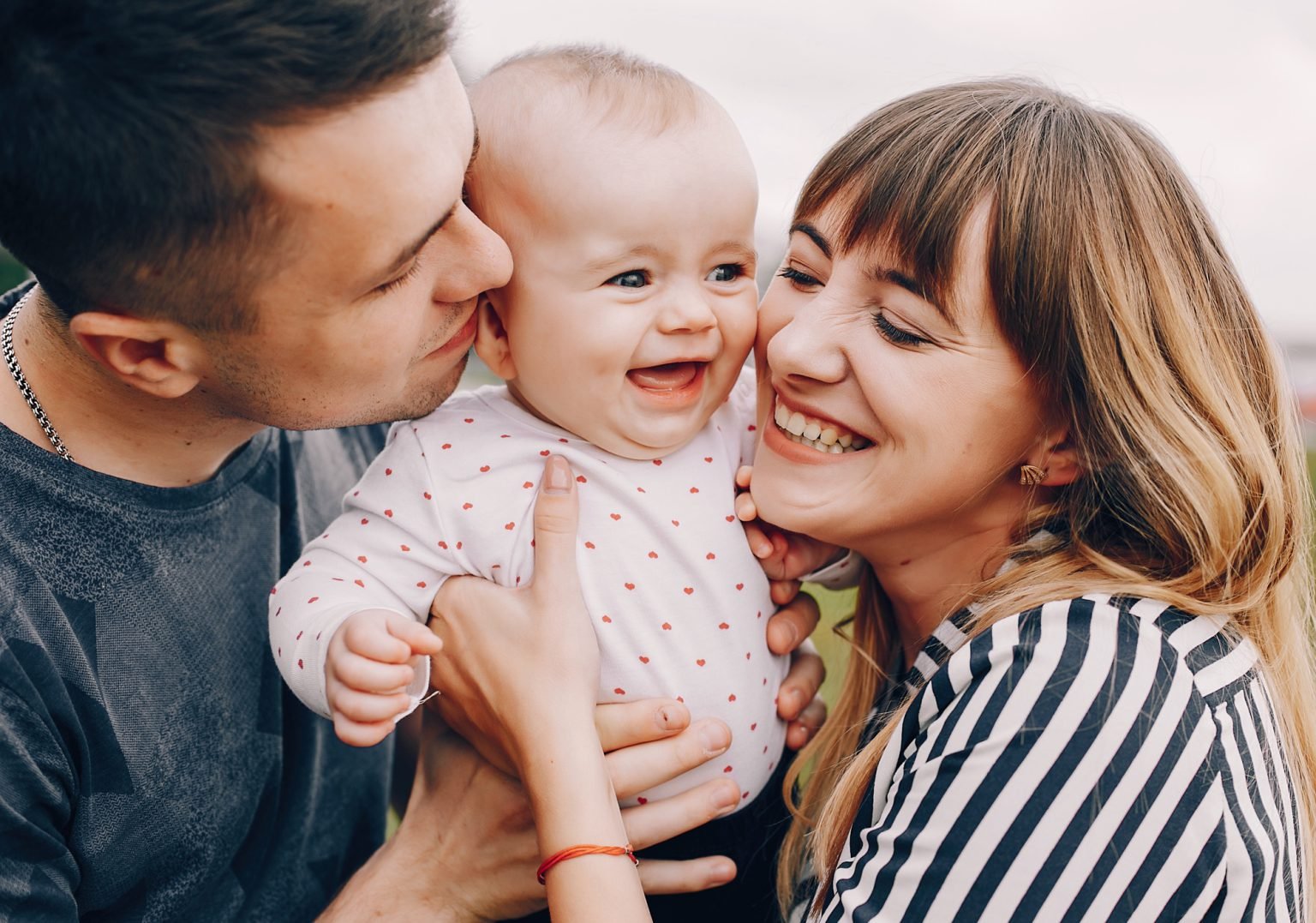 Parents sharing a joyful moment with their baby